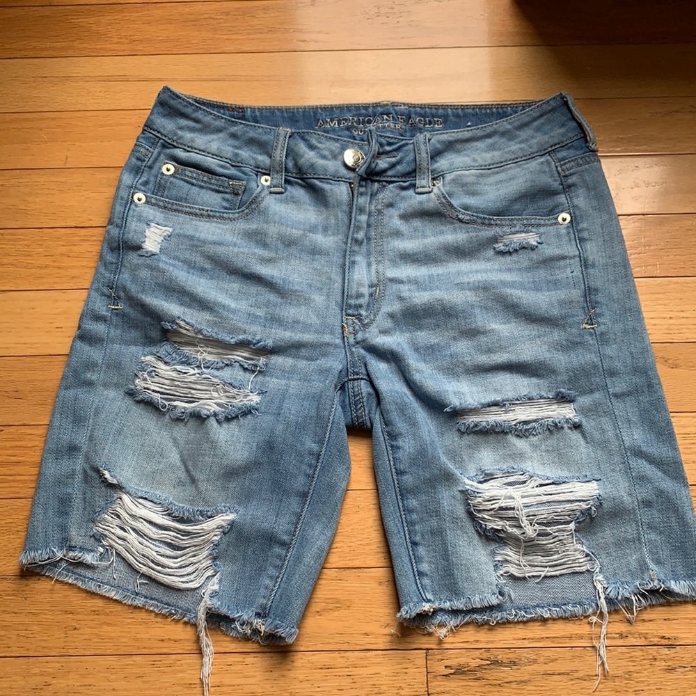 Women’s light wash distressed denim shorts.